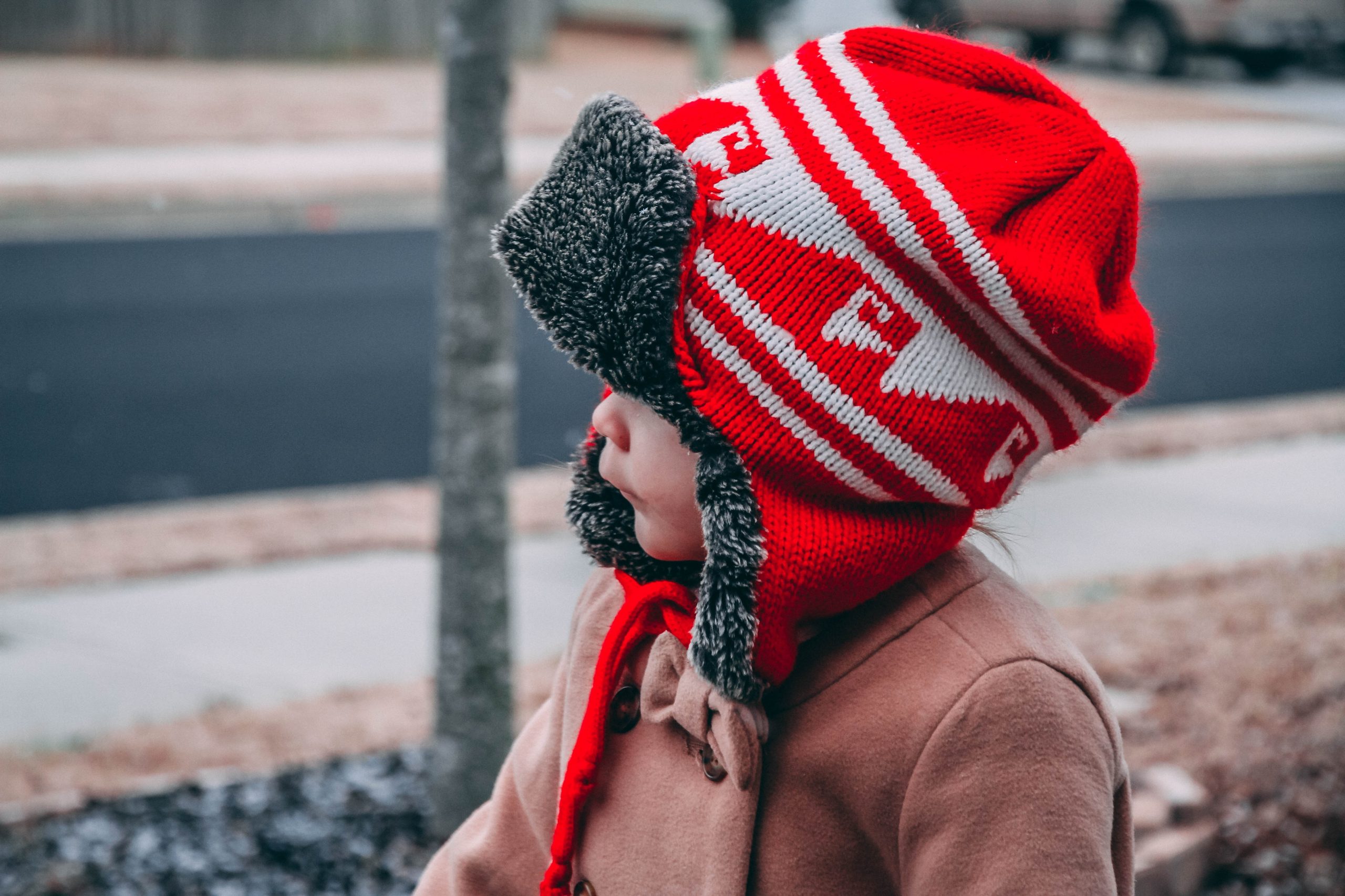 infant wearing a winter hat.