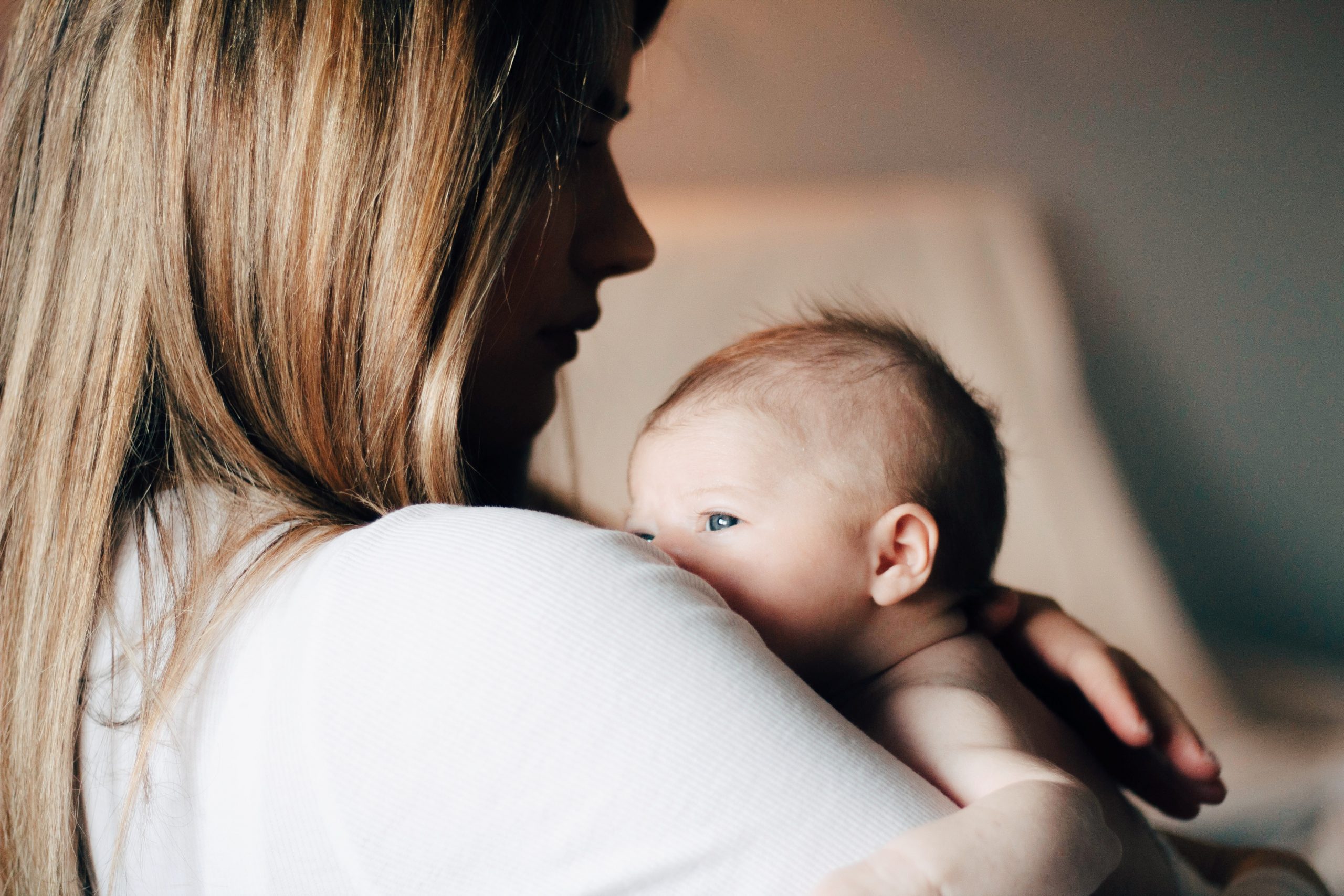 parenting holding and burping baby to prevent reflux